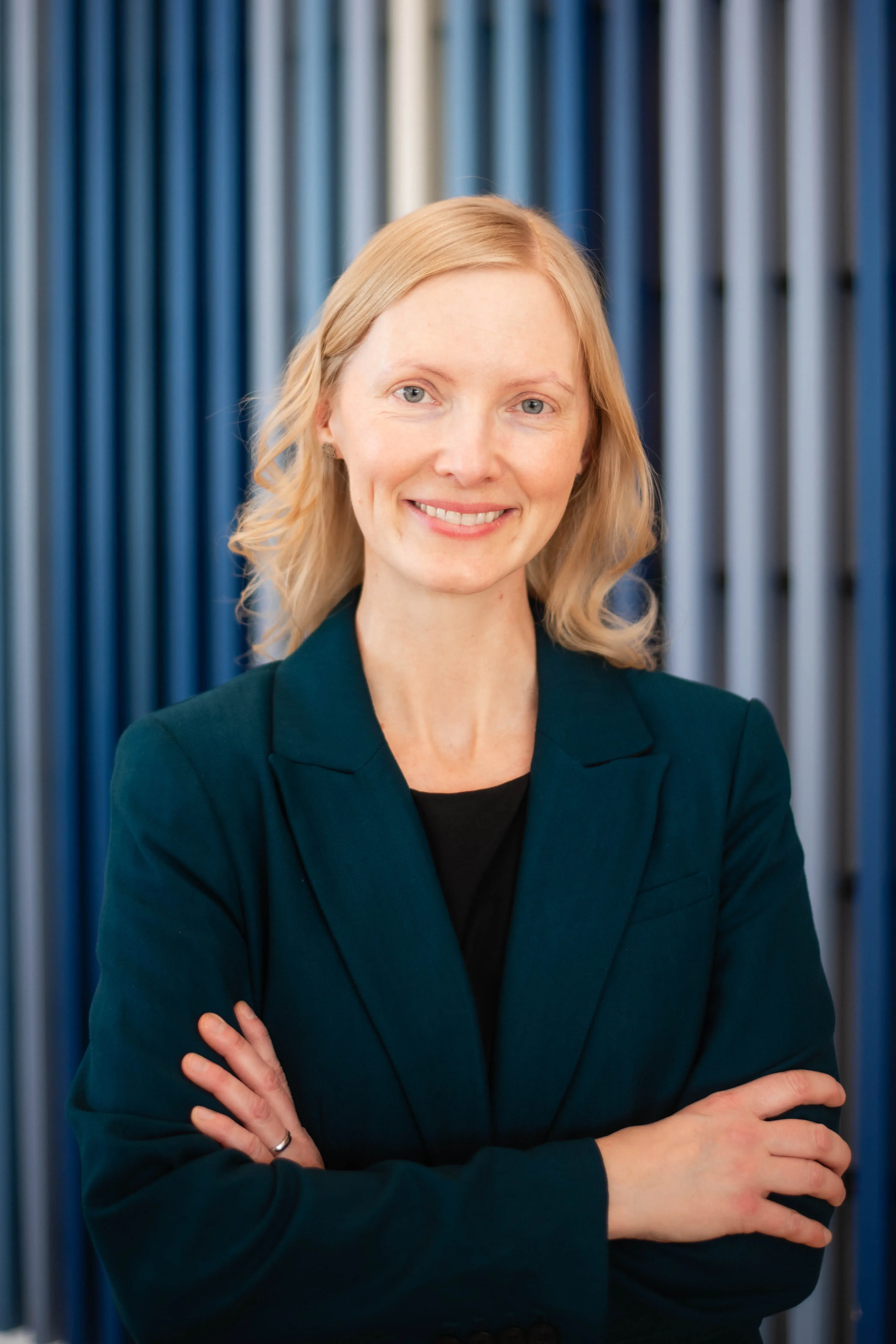 Christy Ferguson Headshot against blue background